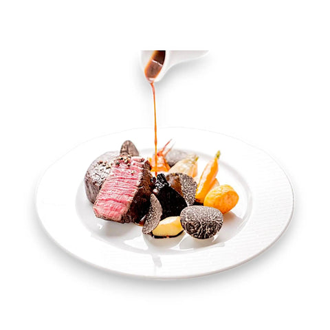 Chocolate-covered almond dessert plate with caramel drizzle from Exquisite Truffle Products for Gourmet Dining
