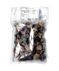 Bag of frozen black truffle pieces from Tuber Melanosporum for gourmet cooking