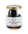 Glass jar of black truffles in brine with a gold lid for Tuber Aestivum product